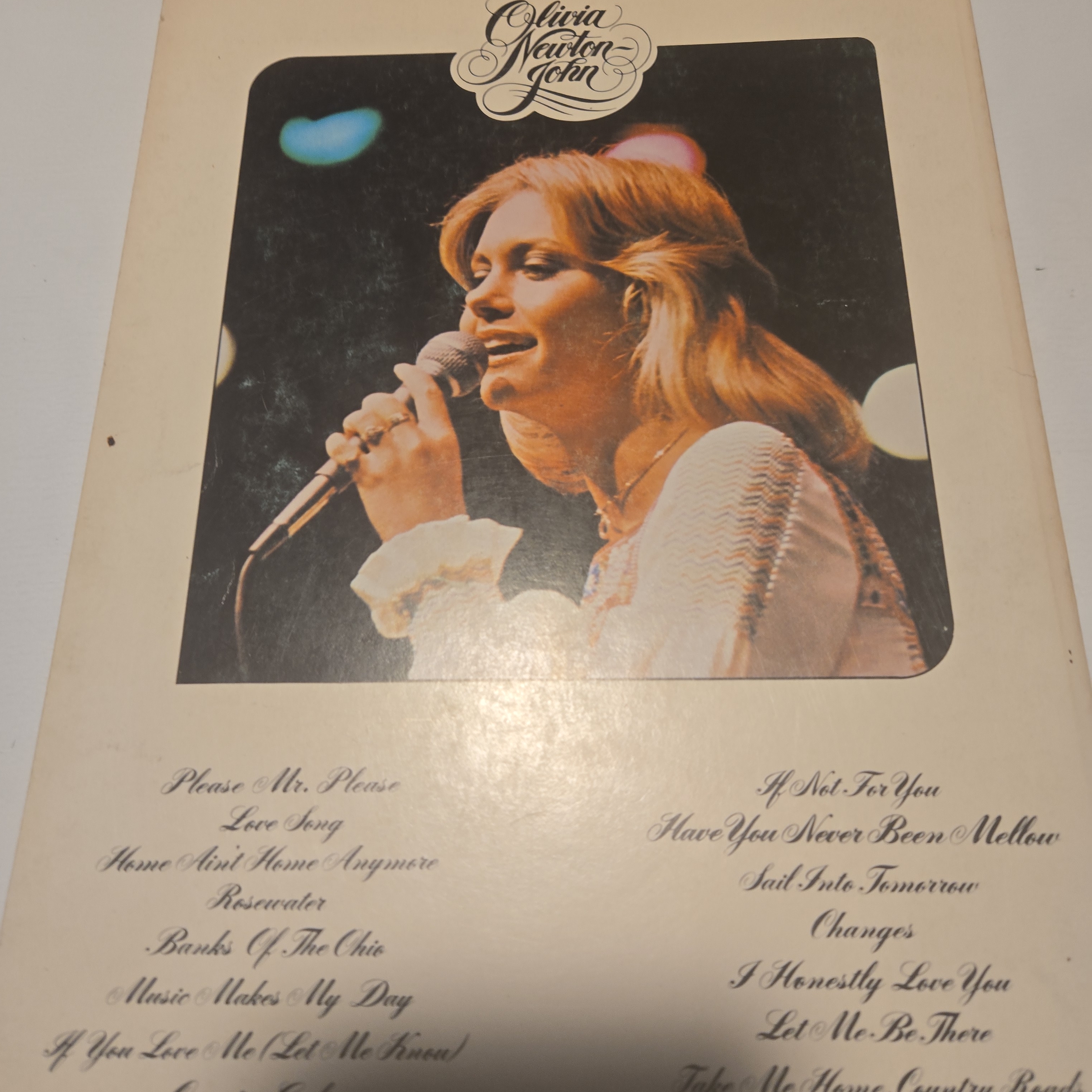Back cover of a vintage vinyl LP sleeve showing the track listing, with visible edge wear and handling marks